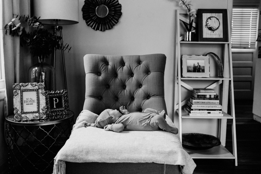 newborn baby on a chair